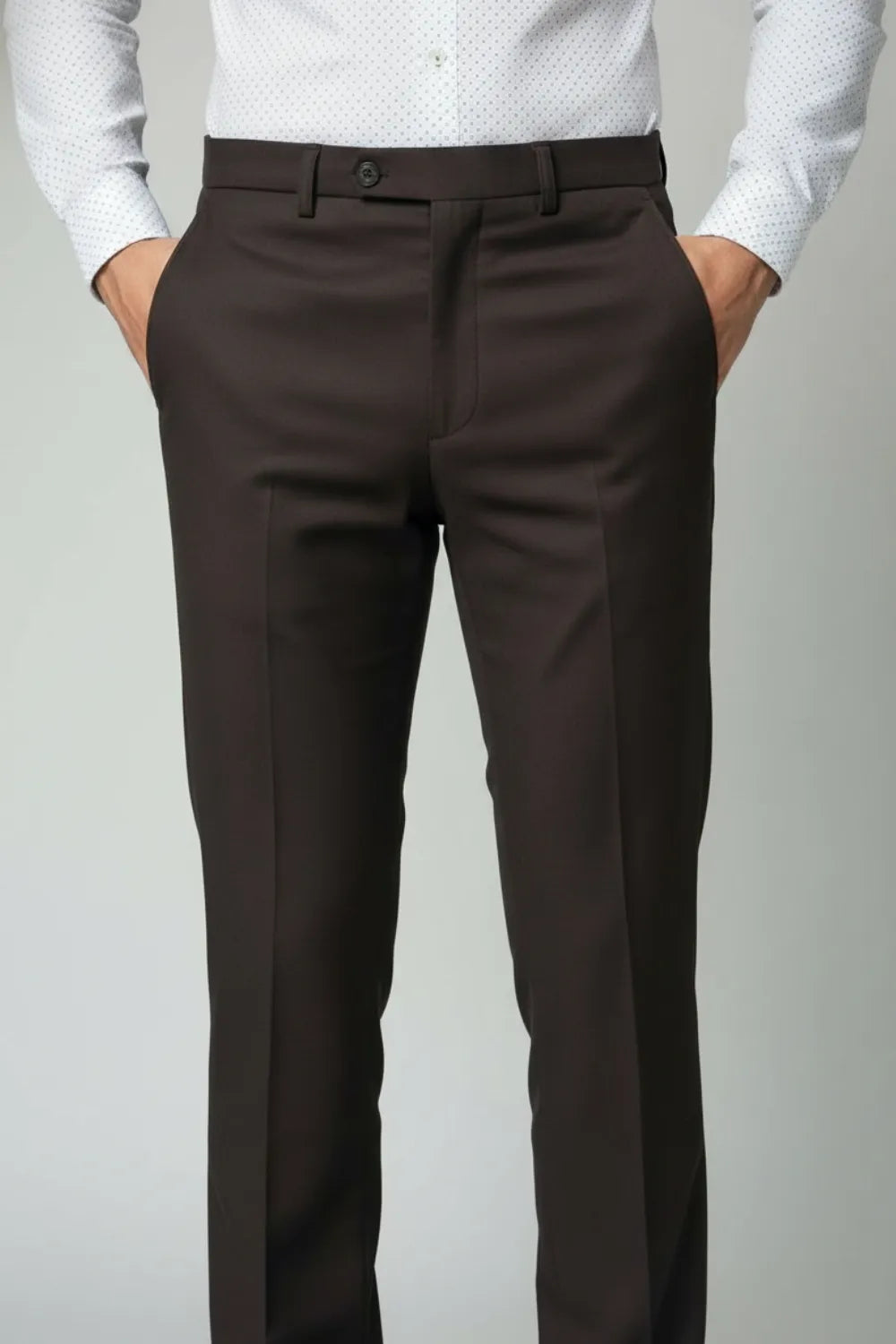 Dark Brown dress pants worn by a person on a plain background