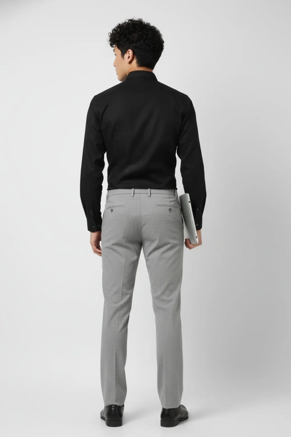 Modern-fit grey trousers styled for professional outfits
