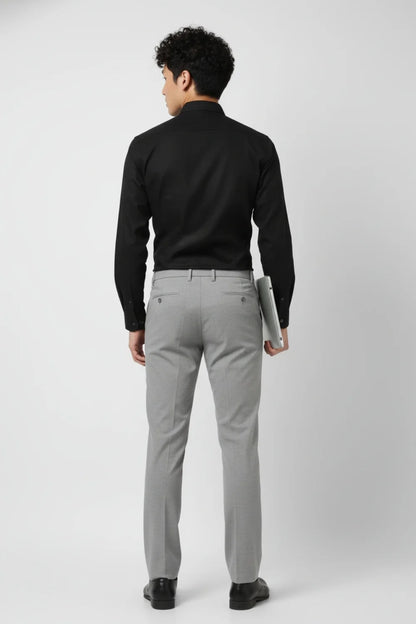 Modern-fit grey trousers styled for professional outfits
