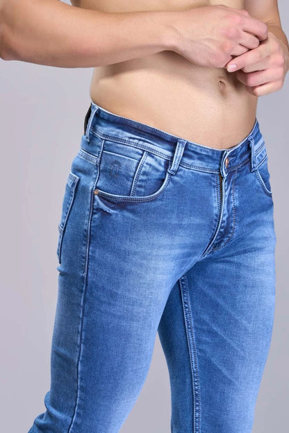 Lifestyle shot featuring blue tapered denim in a relaxed setting
