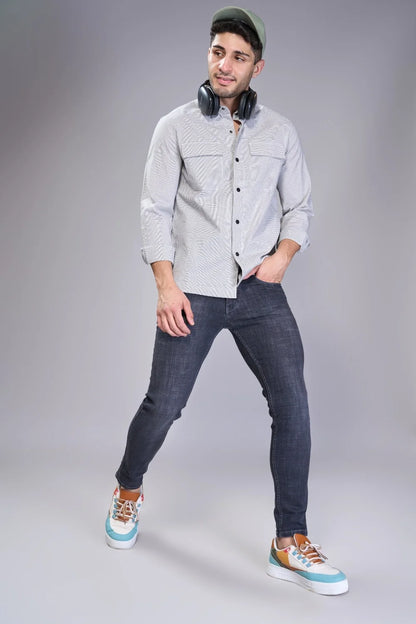 Outfit example combining tapered denim with smart-casual layers
