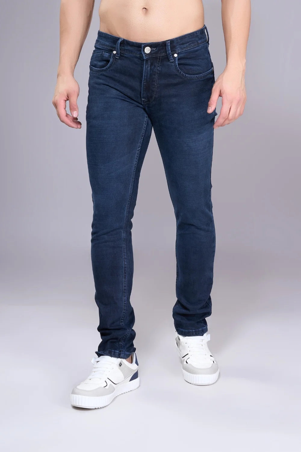 Detail shot highlighting the comfort and stitching of regular fit jeans for men
