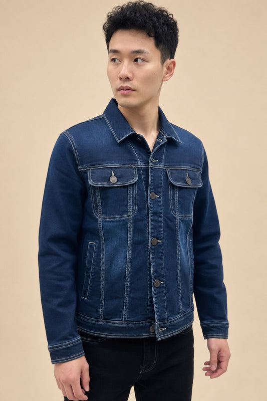 Dark blue denim jacket for men on warm beige studio background