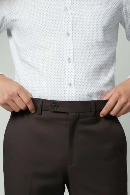 White patterned shirt and brown dark pants closeup view