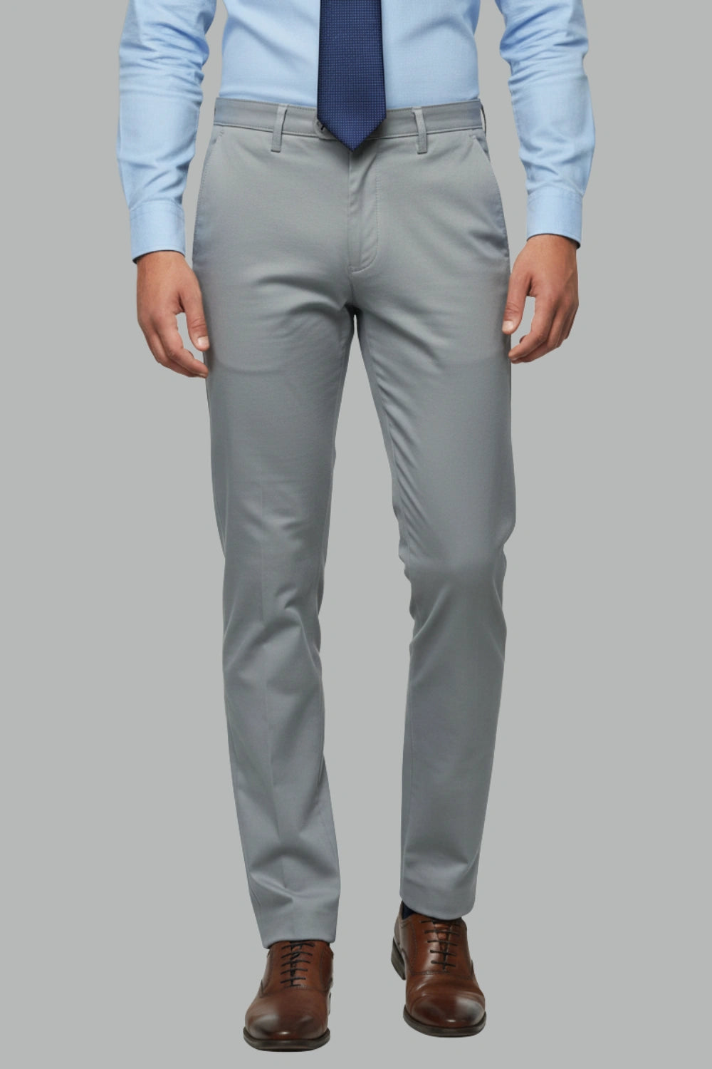 Full view of a man wearing dark grey cotton pants 