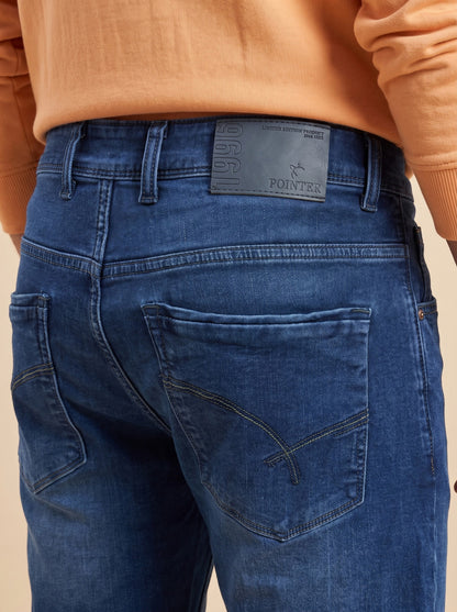 Deep indigo denim jeans showing back pockets and Pointer waistband patch