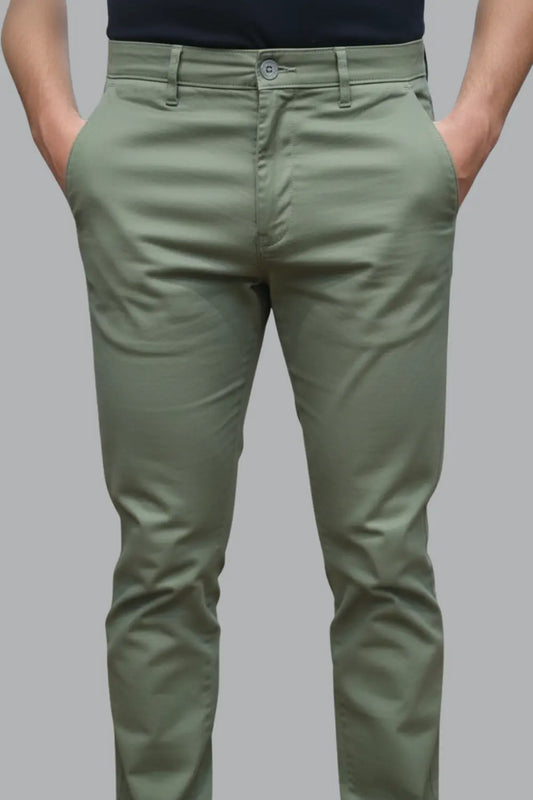 showing the fit and style of the olive green cotton pants