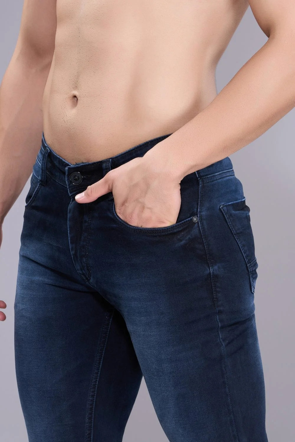 Side profile of blue colour regular fit jeans for men showcasing clean straight silhouette.
