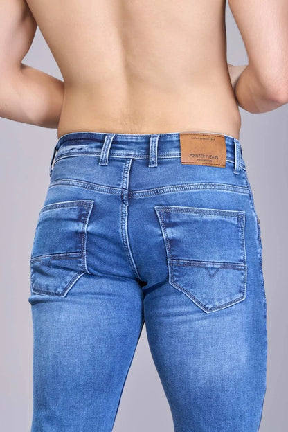 Tonal stitching details on structured blue jeans
