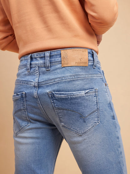 Light blue denim jeans showing back pockets and Pointer waistband patch