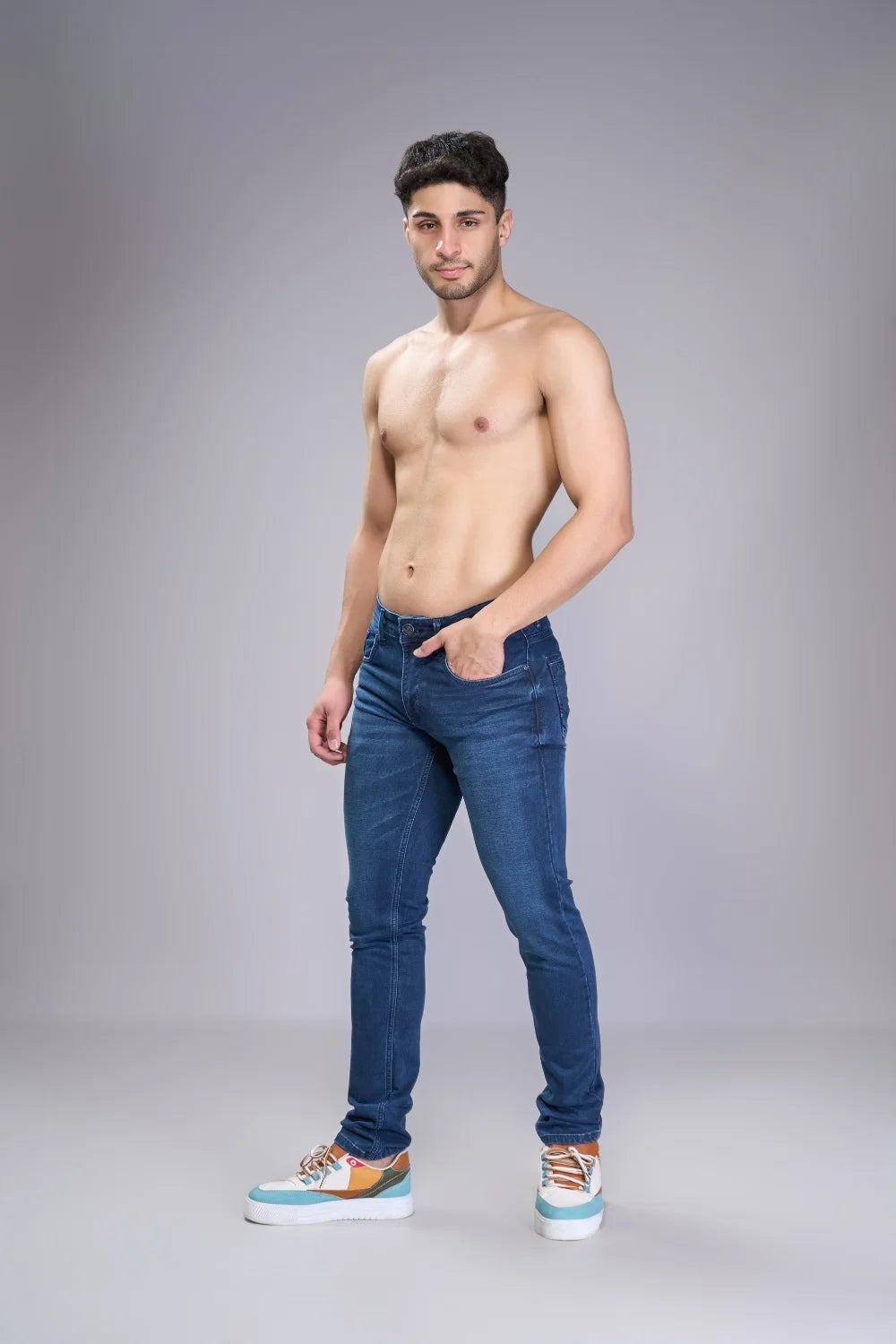 Side profile of men’s light blue regular fit denim jeans
