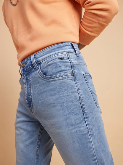 Men's light blue jeans showing side fit and front pocket construction