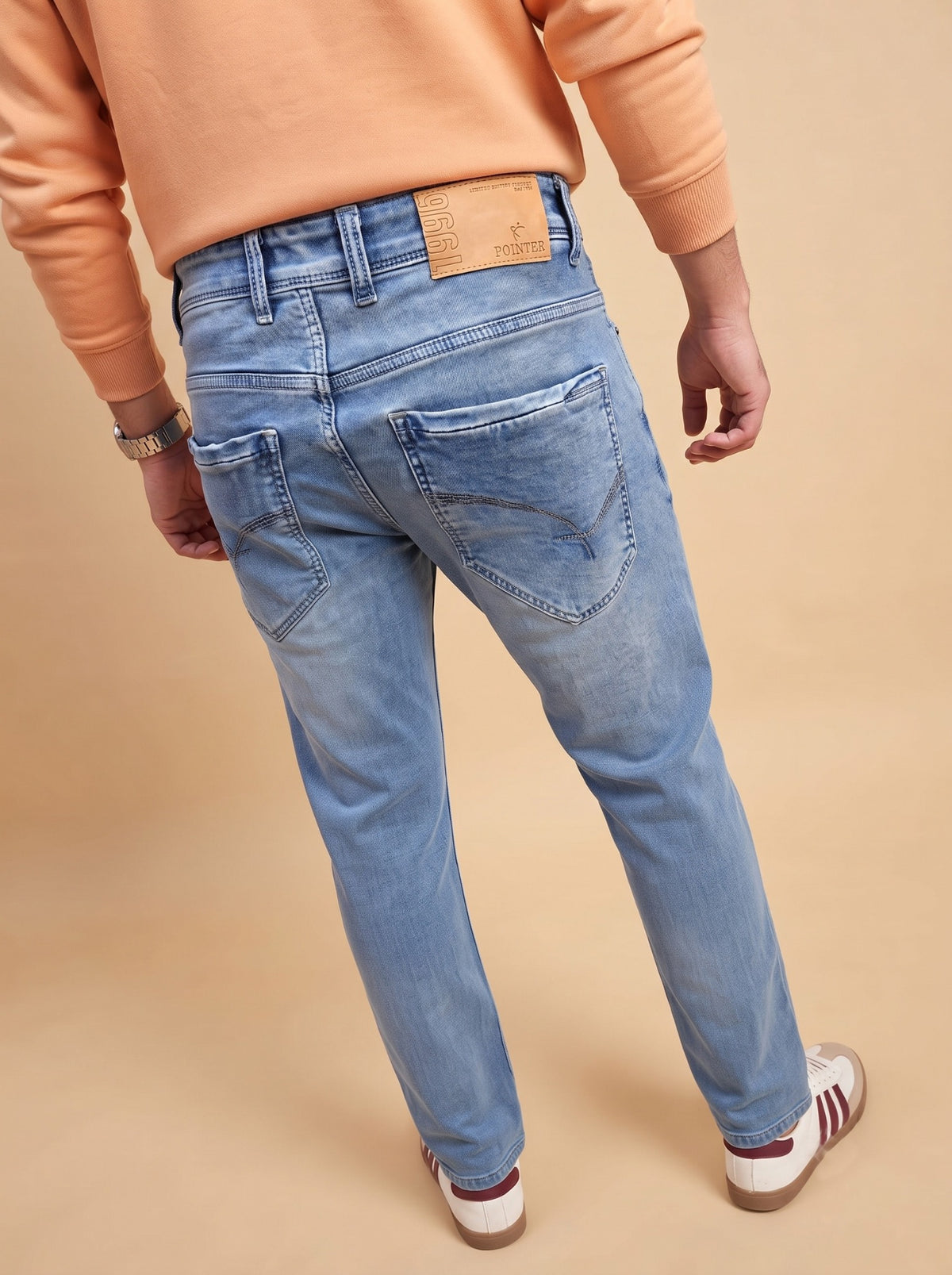 Men's light blue straight fit jeans, full back view