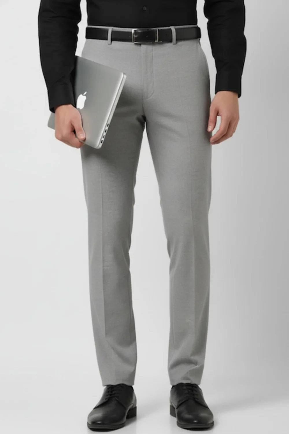 Detailed view of men’s grey ankle-length formal trousers
