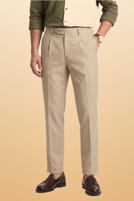 Men's cream slim fit formal pants on orange-beige studio background