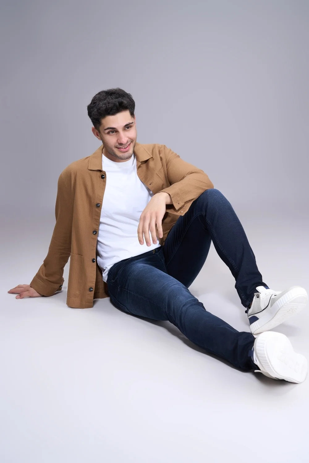 Stretch test of dark blue colour jeans demonstrating flexible denim