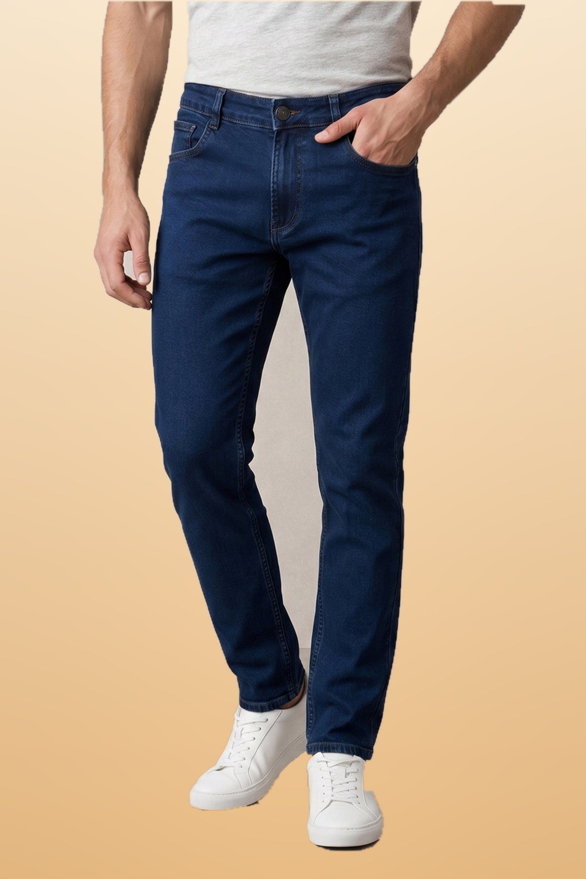 Men's integrity blue slim fit jeans on orange-beige studio background