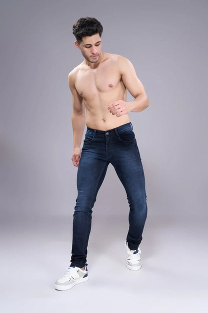 Men’s straight fit blue jeans shown in walking pose for mobility and comfort.
