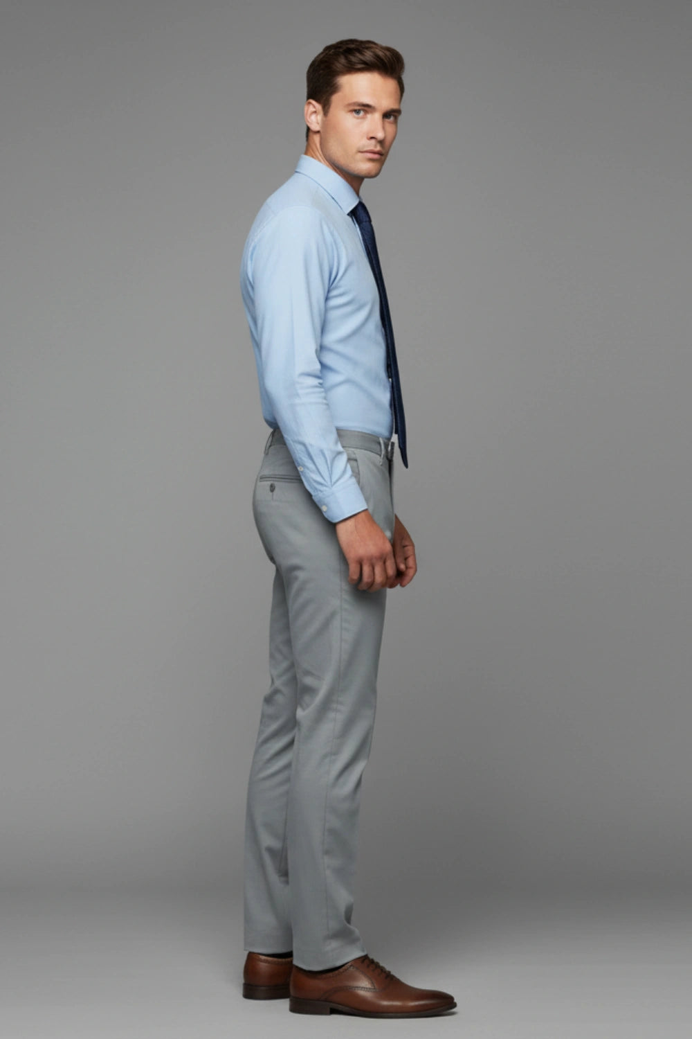 dark grey pants paired with clean light blue shirt