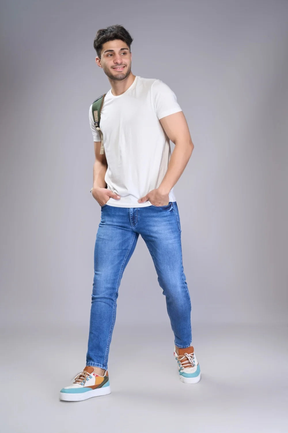 Blue ankle cut denim styled with casual footwear
