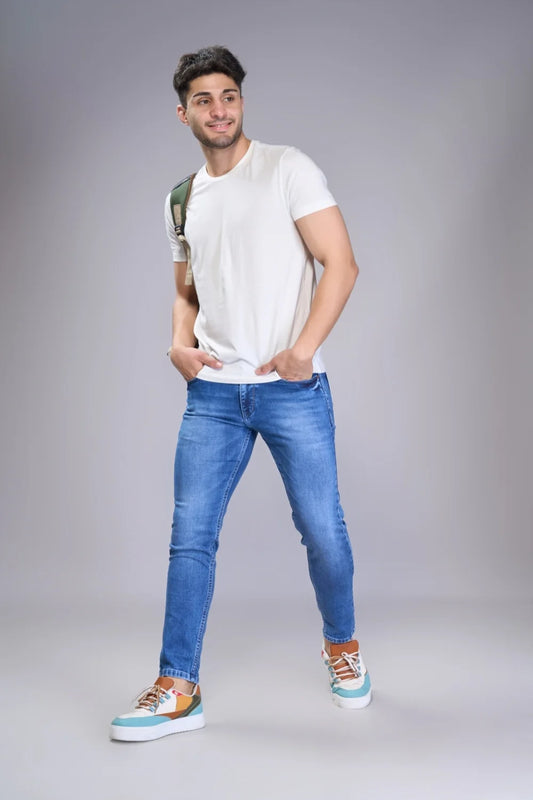 Blue ankle cut denim styled with casual footwear
