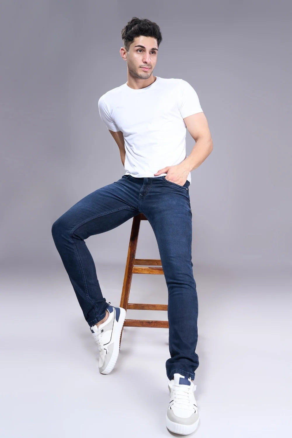 Styling shot of men’s classic regular fit jeans with everyday outfit
