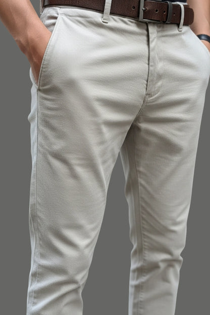 Close-up of the durable waistband construction on light grey cotton pants