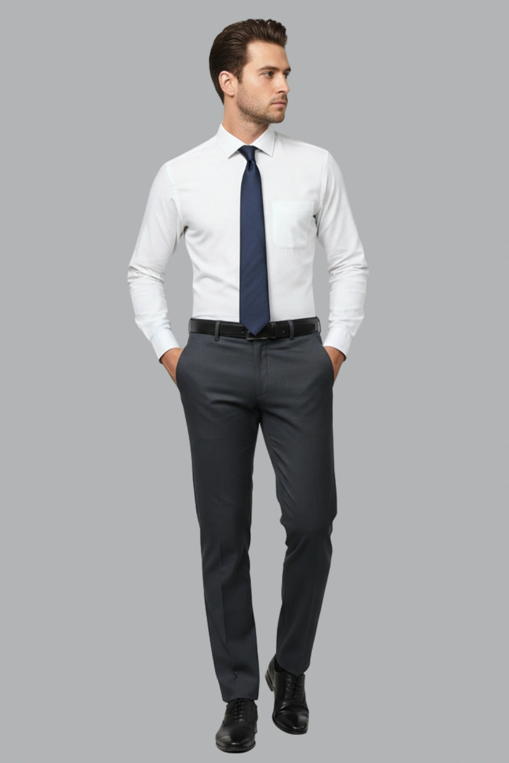 Dark blue cotton pants styled with a leather belt and tucked-in shirt