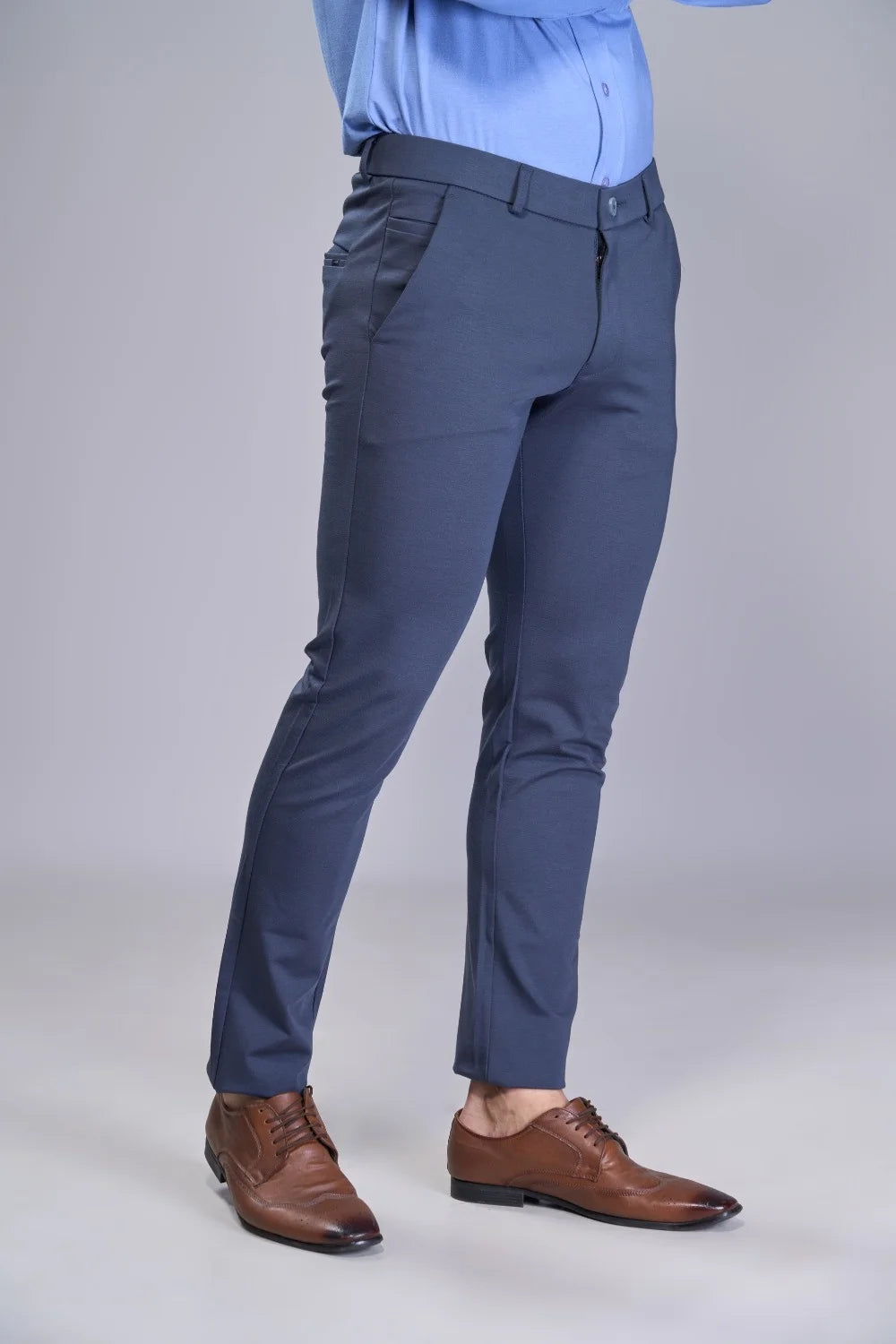 Tapered-fit grey trousers crafted for structure and active movement
