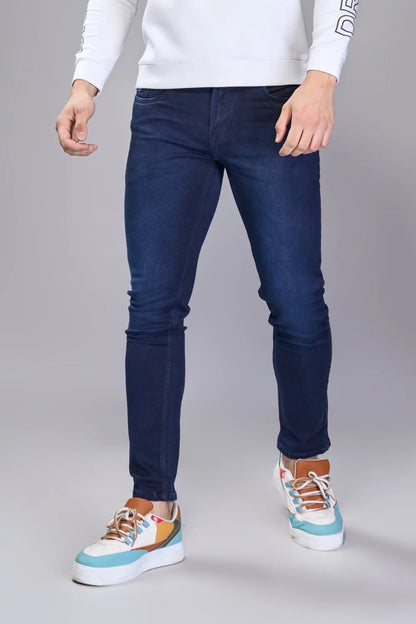 Clean cropped silhouette in navy emphasizing footwear and proportion
