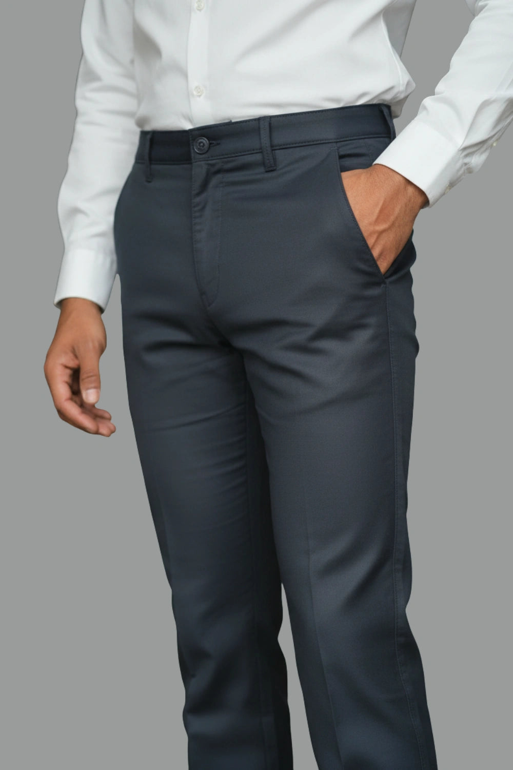 A model wearing dark blue cotton pants paired with white shirt