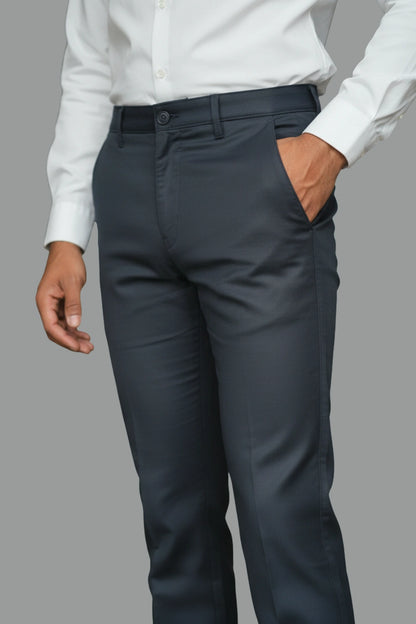 A model wearing dark blue cotton pants paired with white shirt