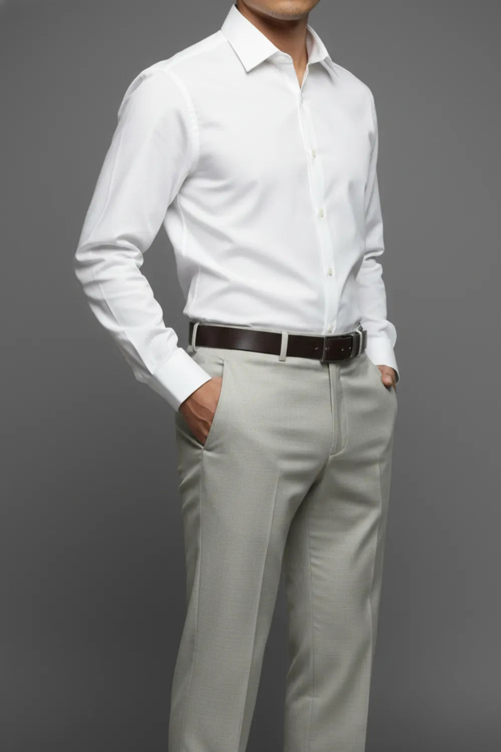 Person wearing a white dress shirt and White gray texture pants against a gray background
