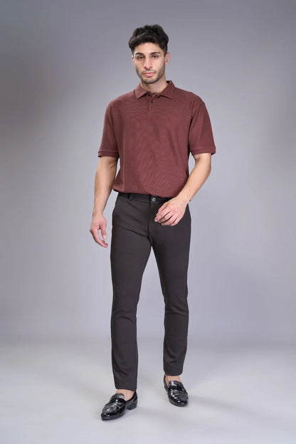 Performance-knit brown trousers offering shape retention and softness
