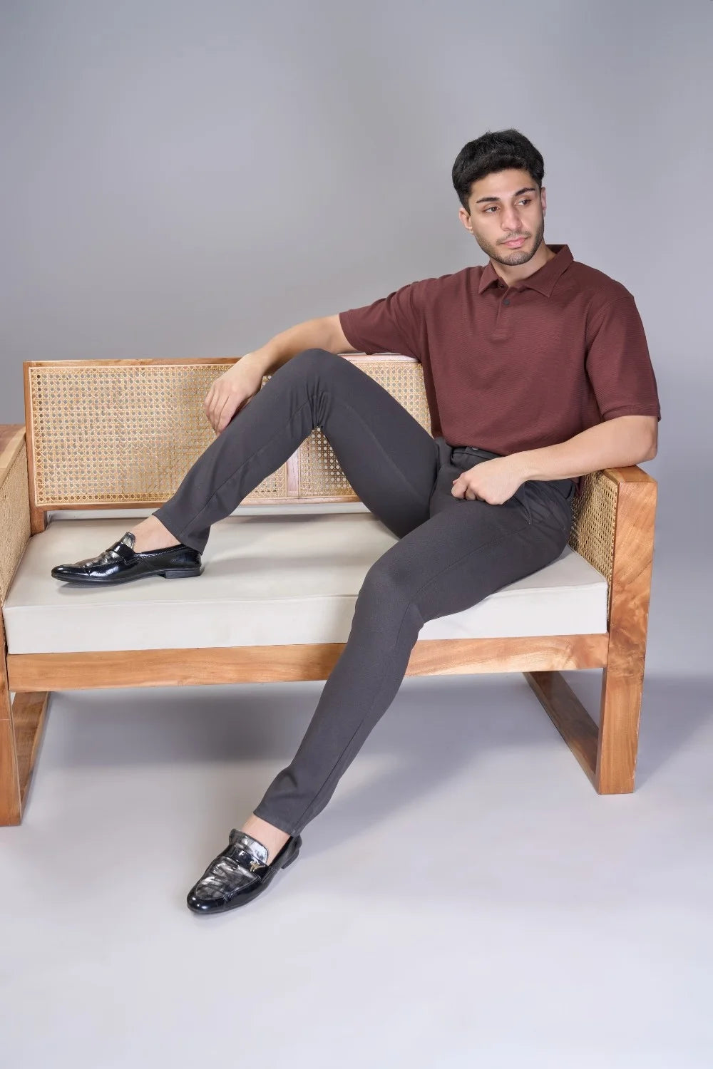 Performance-knit grey trousers offering soft stretch and shape retention
