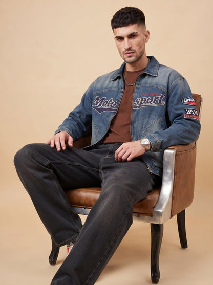 Seated styling view showing the relaxed silhouette of black loose fit jeans