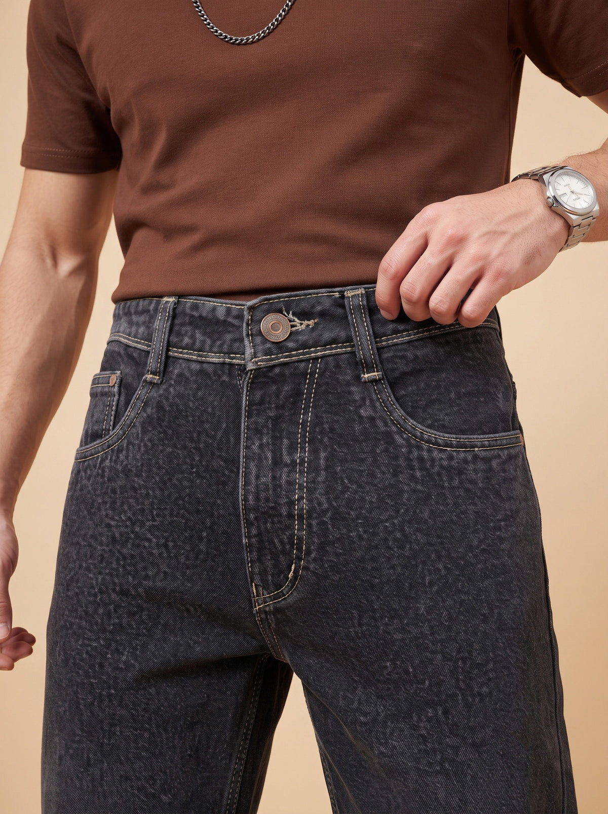 Black denim waistband, metal button, belt loops and contrast stitching