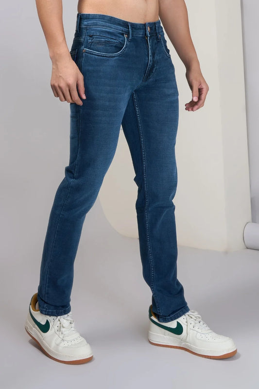 Comfortable men’s dark blue jeans highlighting regular-fit design
