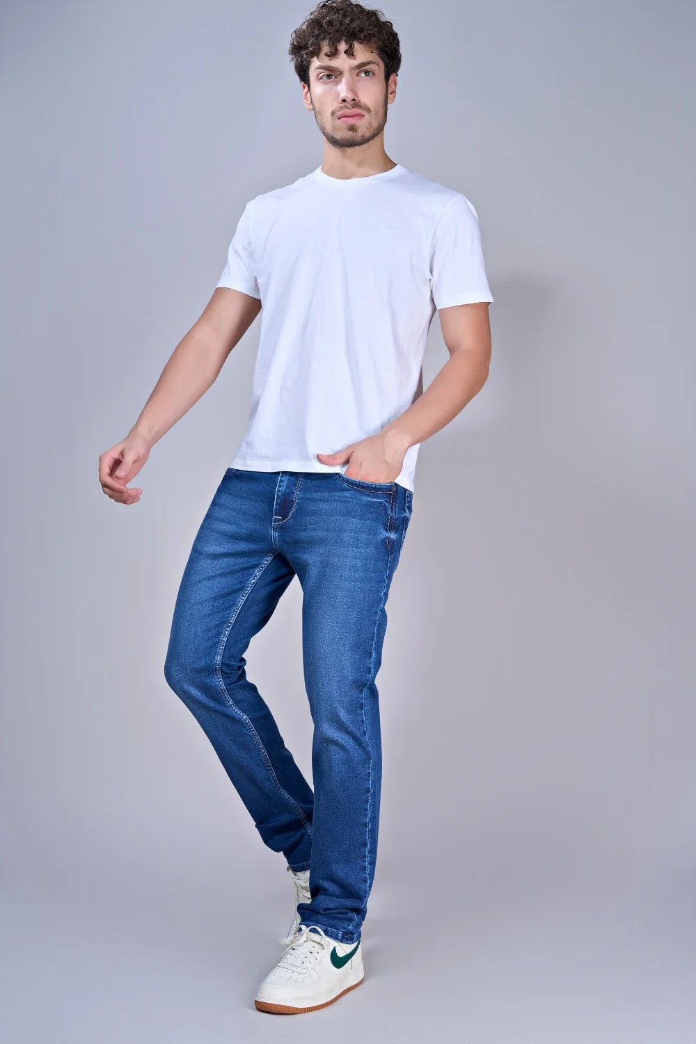 Full-length view wearing Pointer Jeans faded blue jeans