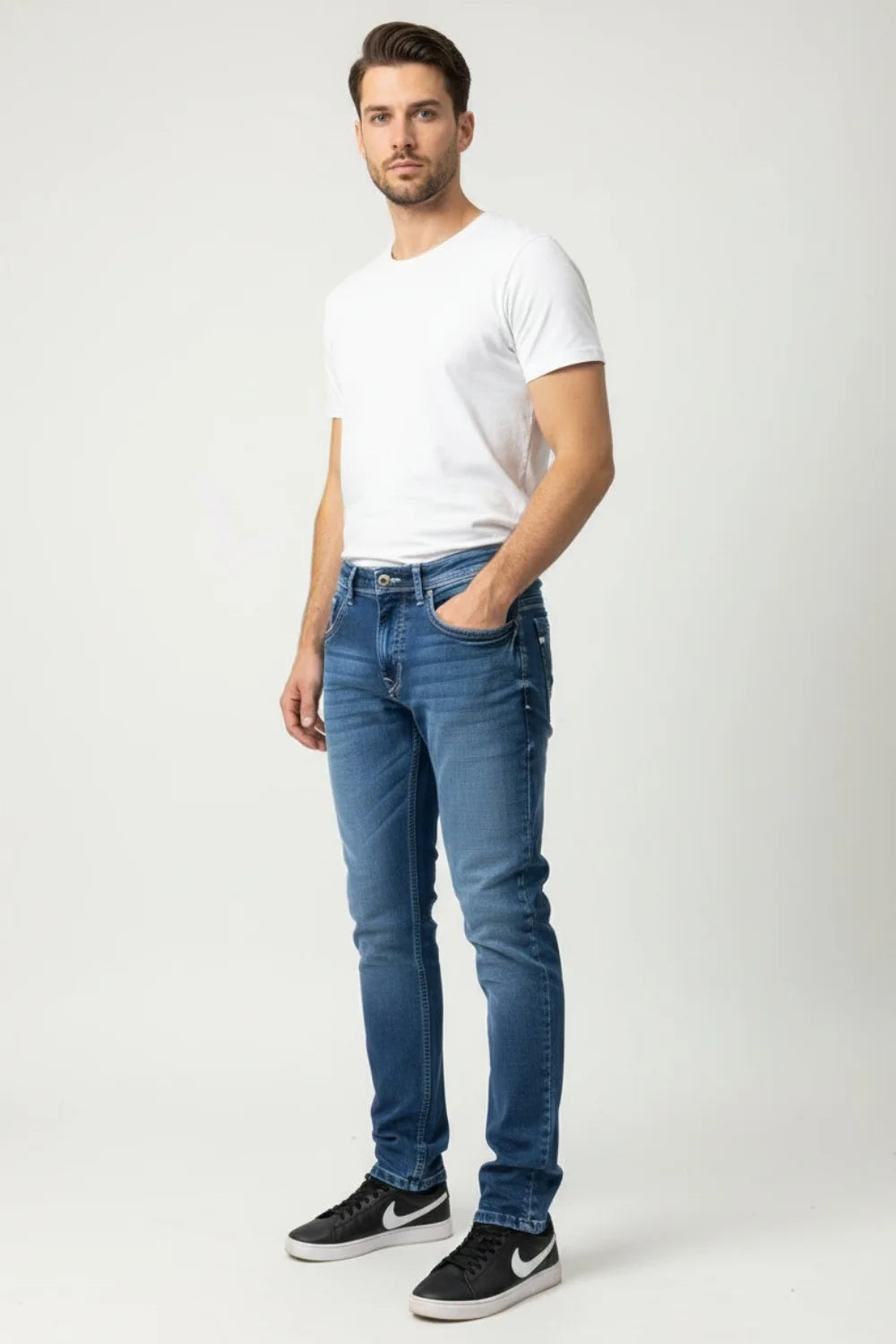 Full body view wearing Pointer Jeans regular fit blue denim