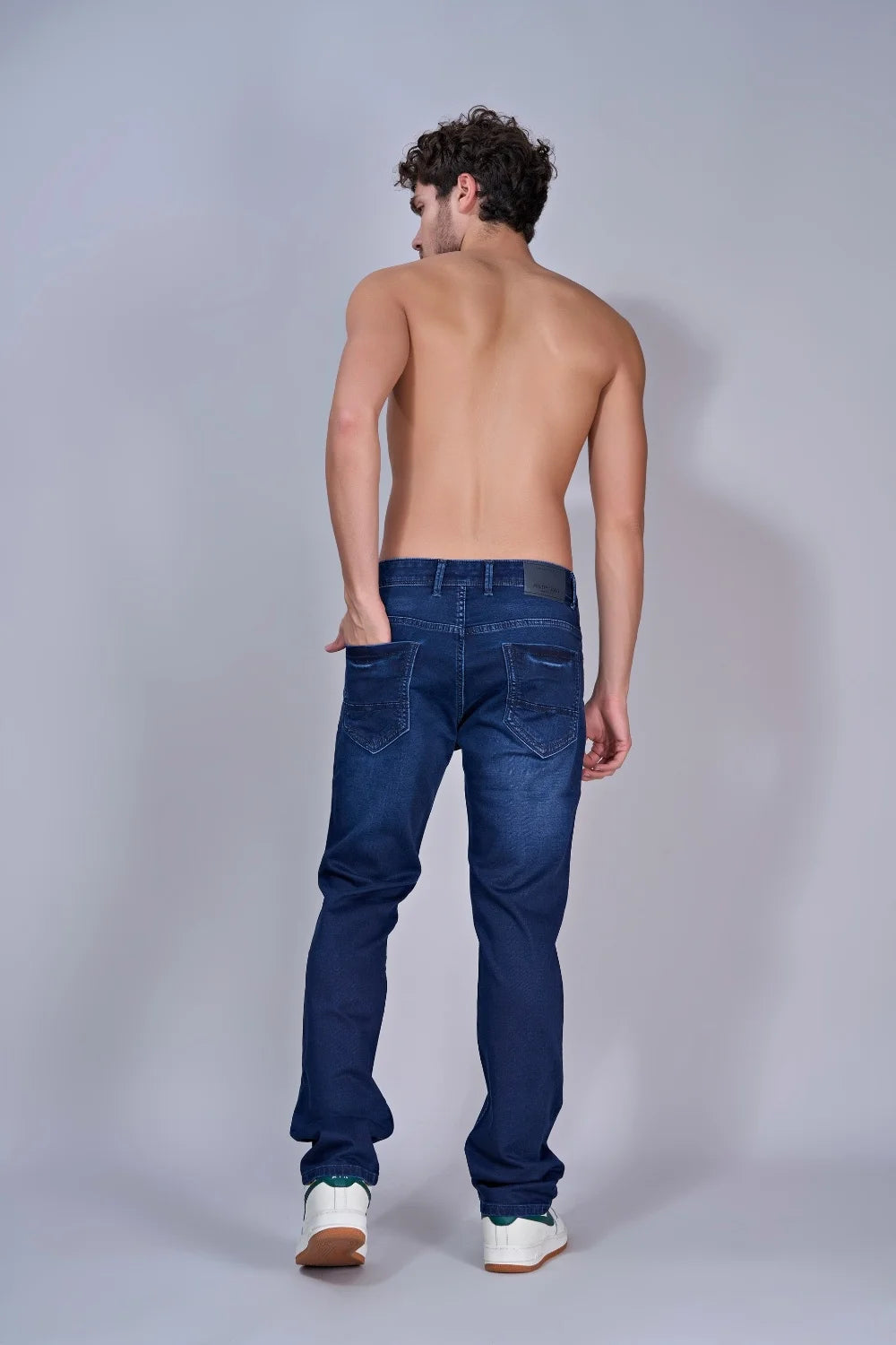 Back view of men’s royal blue straight fit jeans