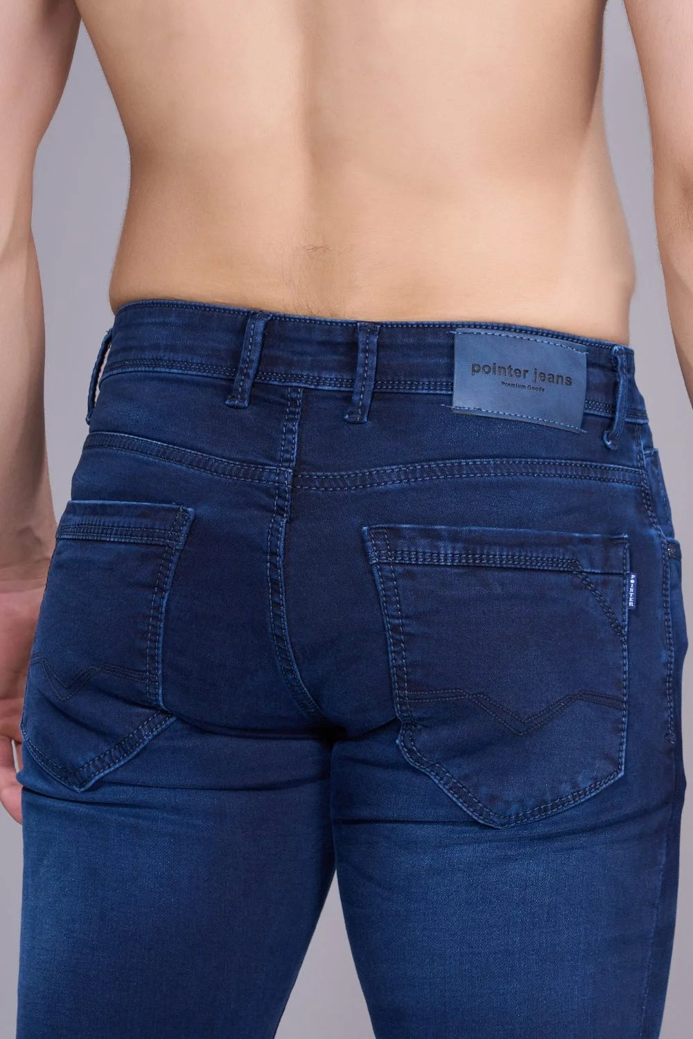 Close-up of high-quality dark blue denim fabric for men
