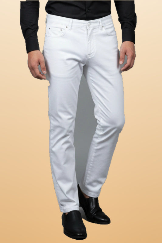 Men's premium white cotton pants on orange-beige studio background