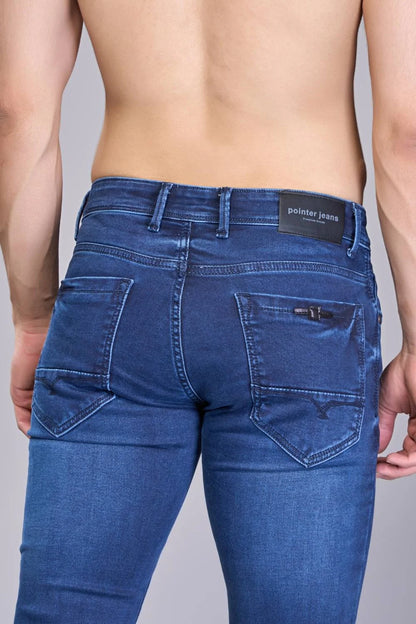Back view showing pocket and stitch details of men’s regular fit blue jeans
