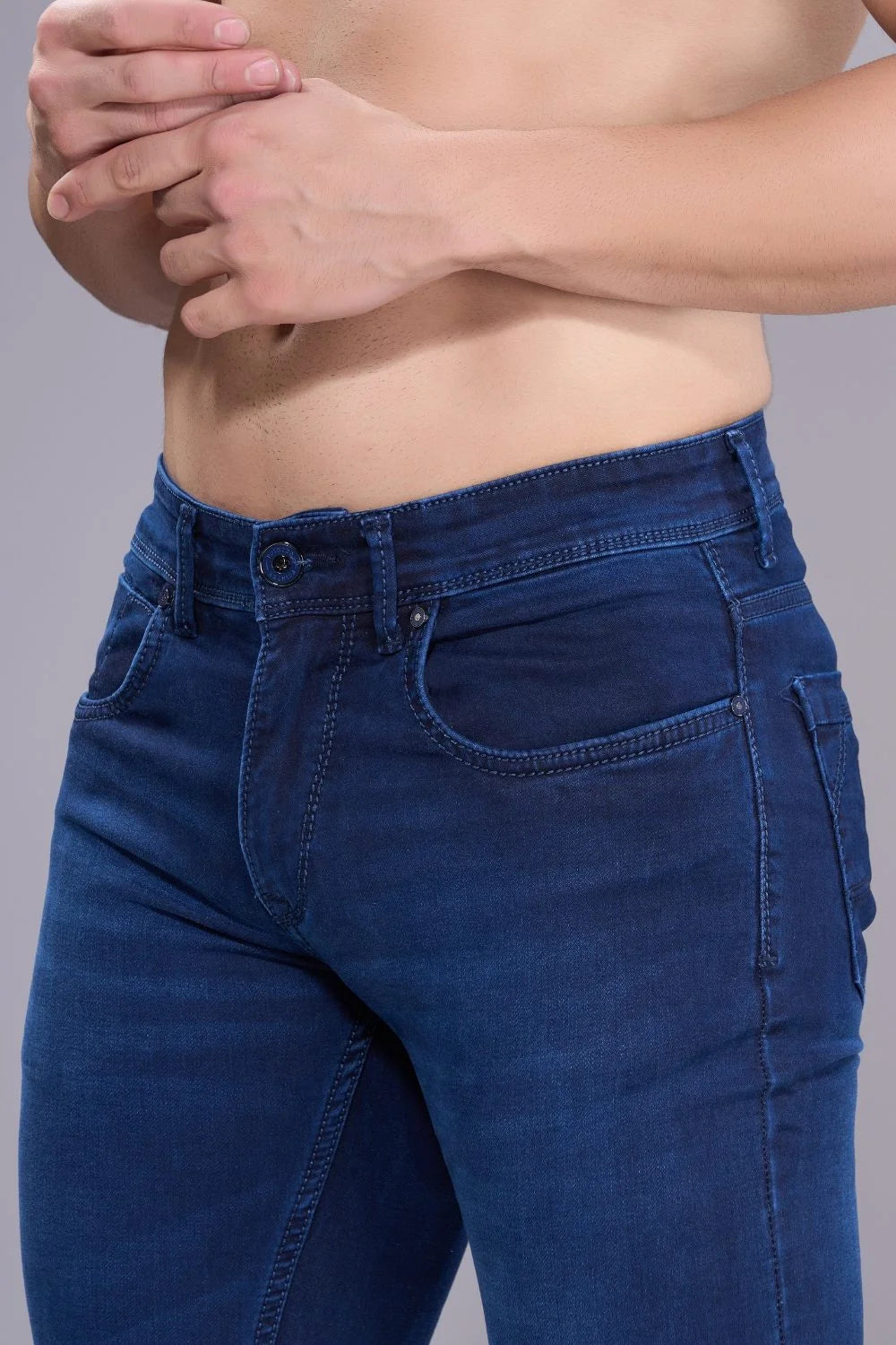 Side profile of men’s dark blue regular fit jeans showing clean silhouette
