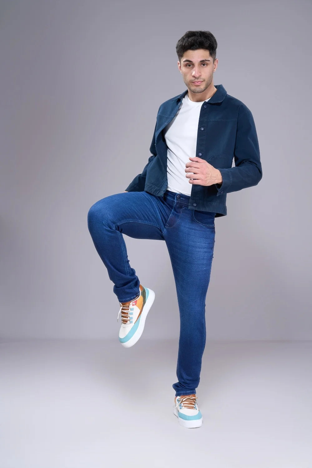 Men’s regular fit denim jeans showing walking pose for comfort and mobility
