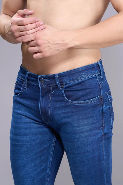 Close-up of waistband and pocket detailing on premium regular fit denim jeans
