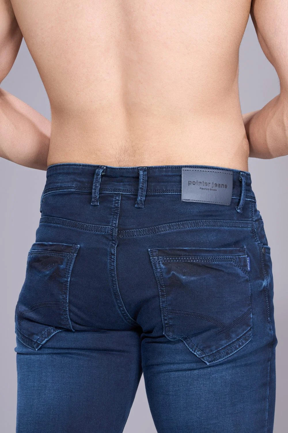 Back view of regular jeans for men in solid blue denim