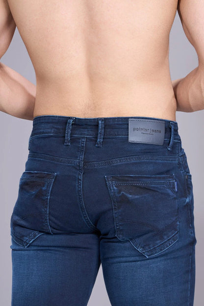 Back view of regular jeans for men in solid blue denim