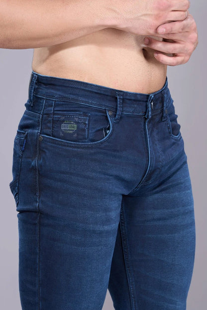 Close-up of stitching and fabric texture on regular jeans for men